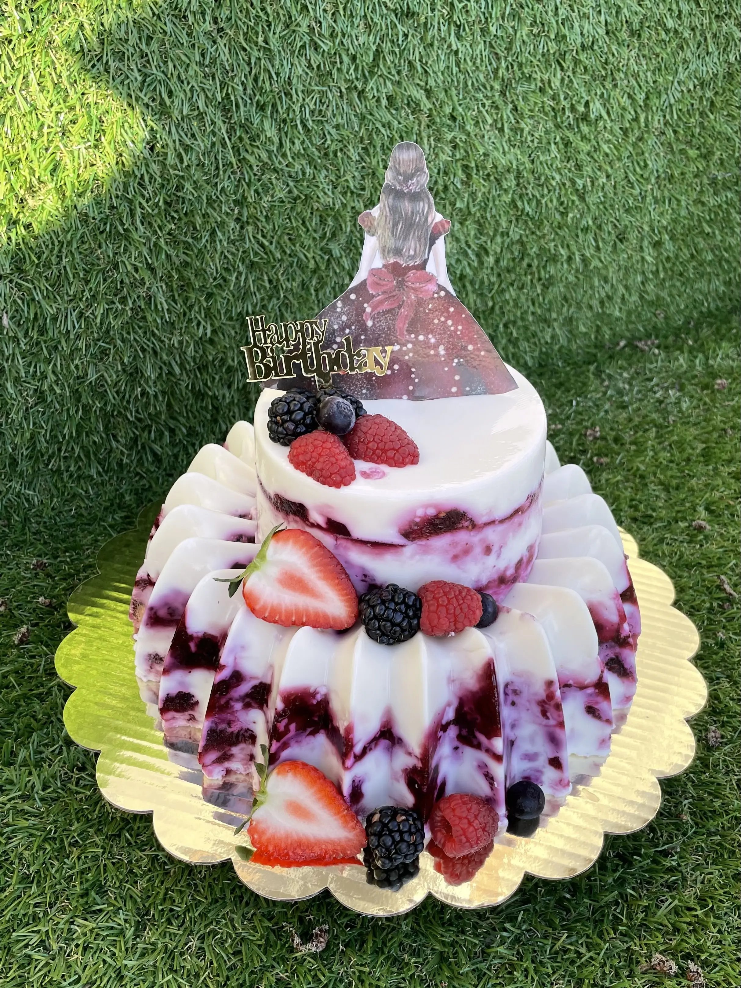 Cream cake crowned with blackberries and strawberries, handmade in Lincoln
