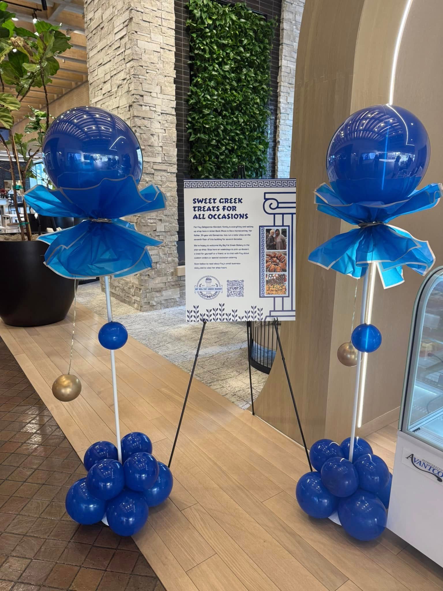 Royal blue balloon centerpieces set up for a Lincoln business event