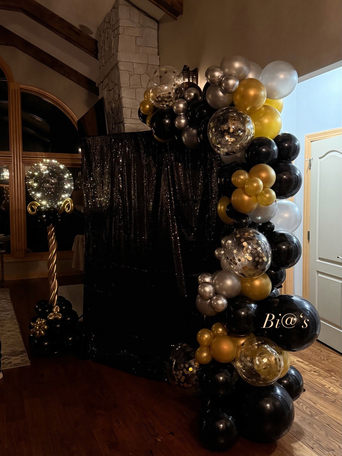 Black and gold balloon column built for a Lincoln party entrance