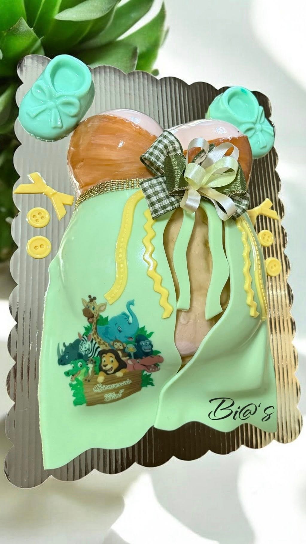 Green baby shower cake with a hand piped bow, made to order in Lincoln