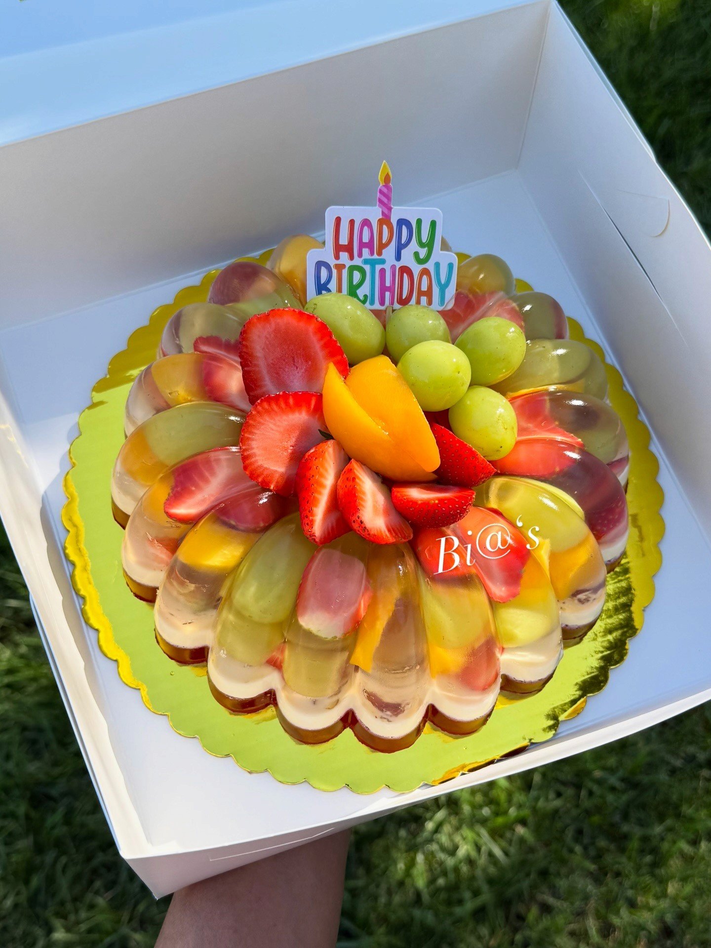 Fresh fruit gelatin cake boxed for pickup in Lincoln, Nebraska