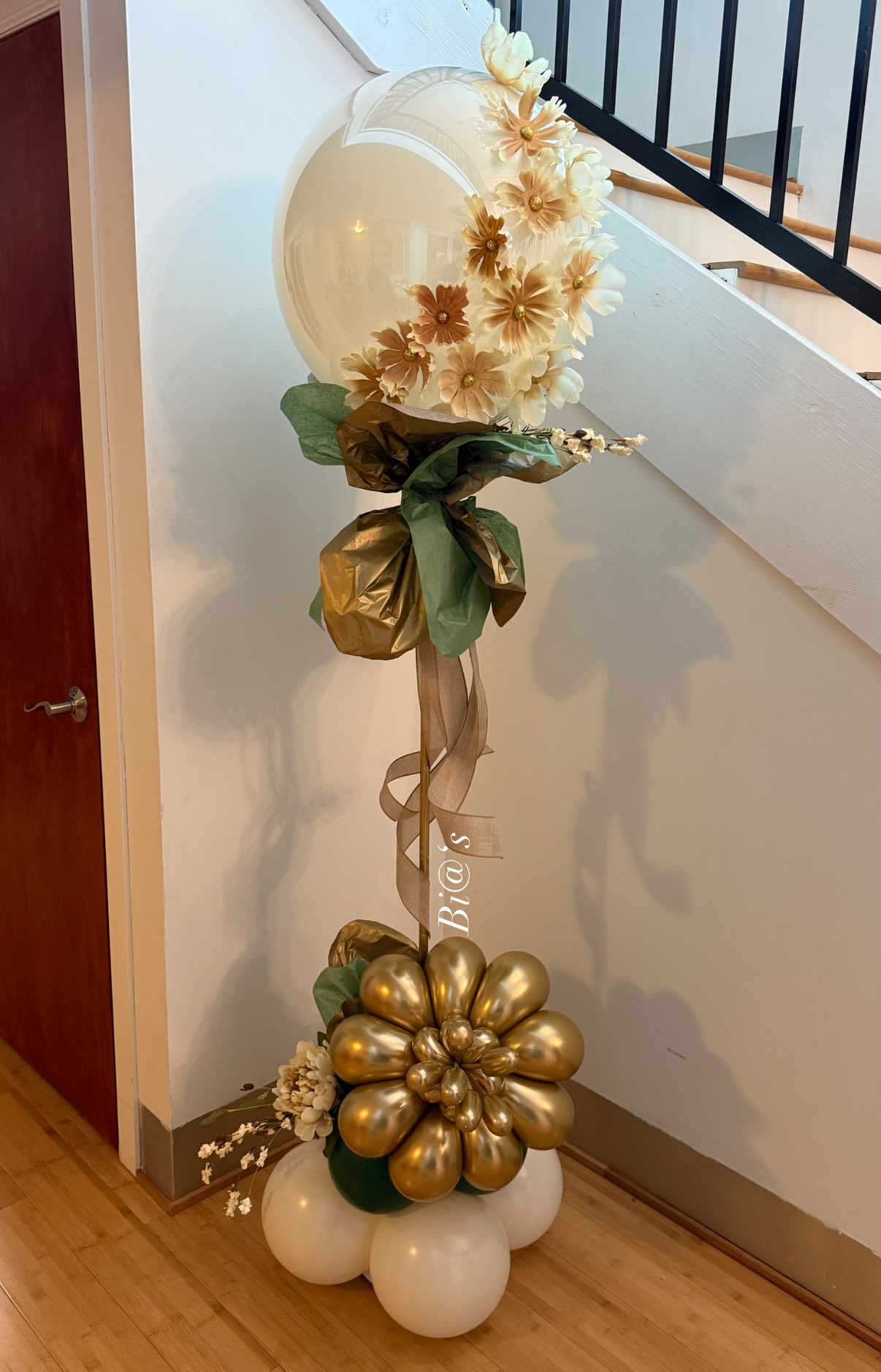 Gold and sunflower balloon column for a Lincoln party entrance